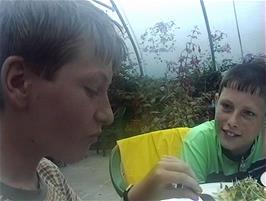 Andrew enjoys his evening meal at the Applecross campsite, watched closely by Dominic